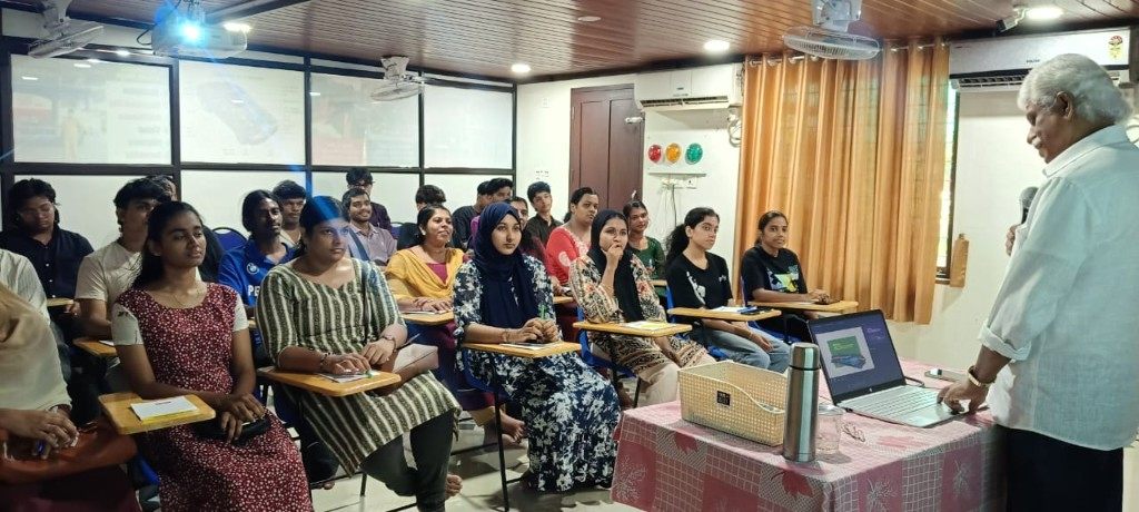 Instructor teaching a classroom session with a laptop