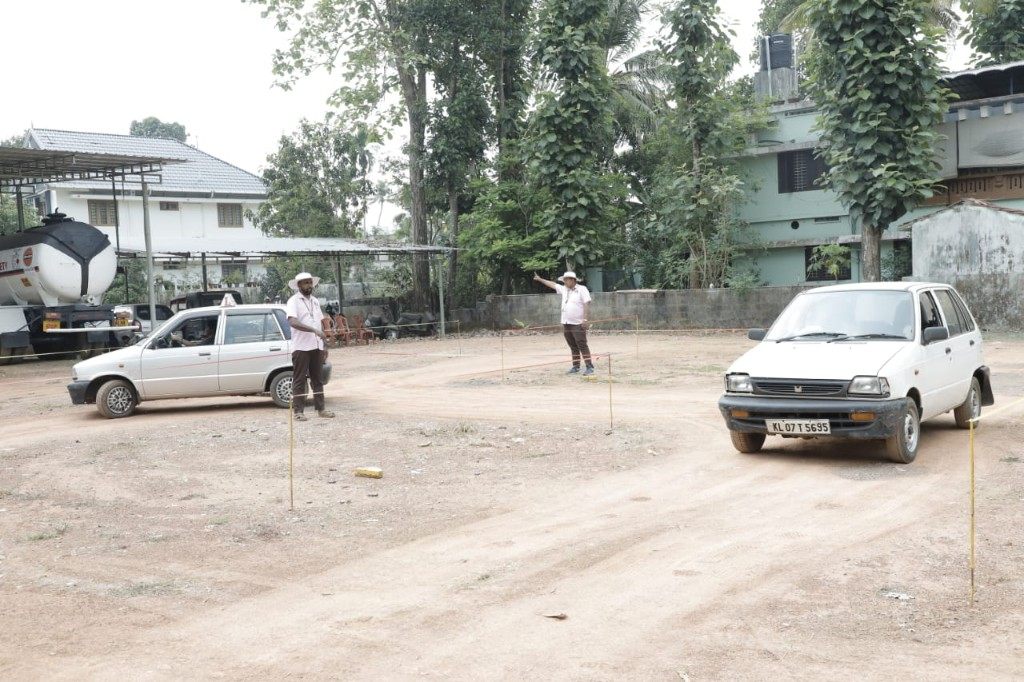 Outdoor practice ground with instructor directing a student