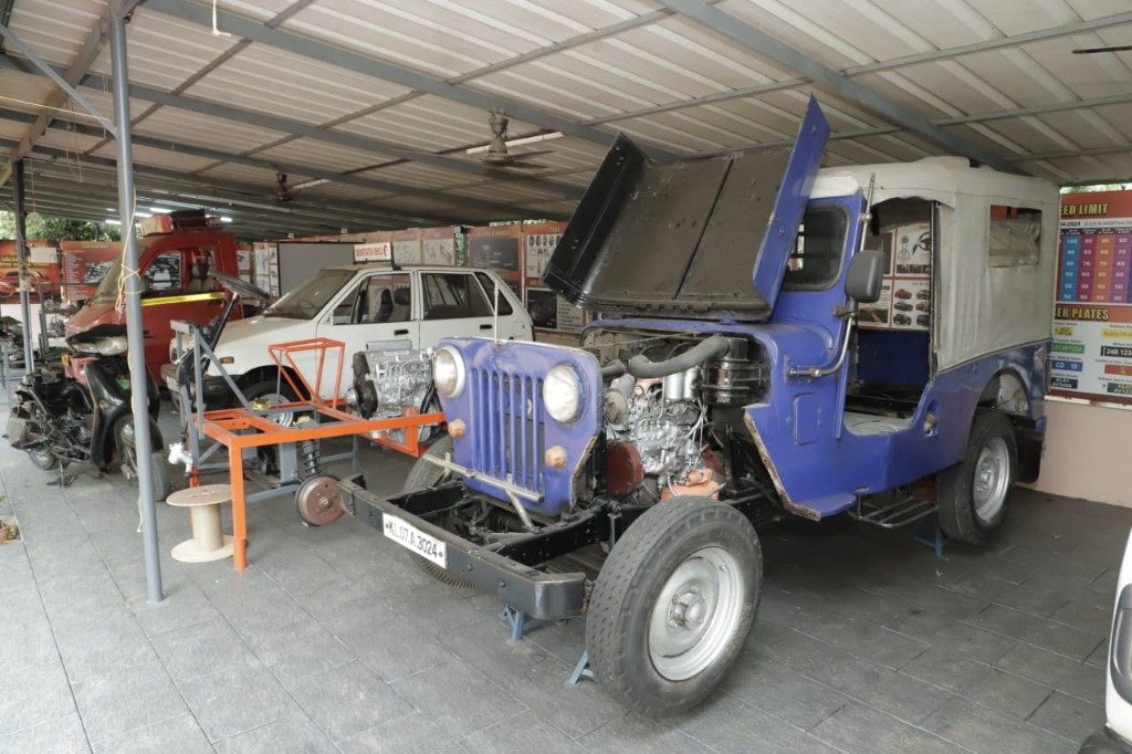 Cutaway jeep training vehicle with road sign charts