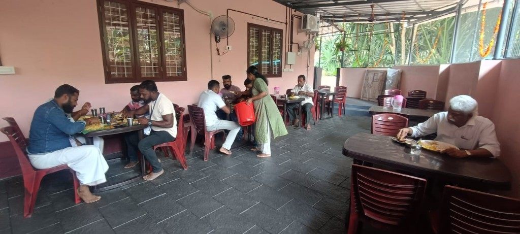 Customers dining at tables in the restaurant